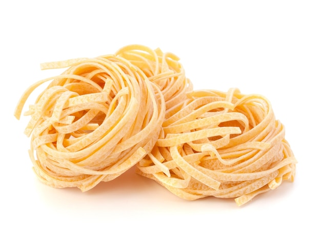 Italian pasta tagliatelle nest isolated on white background