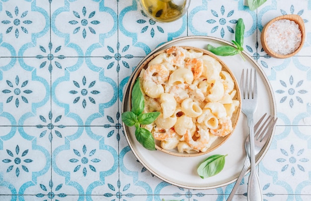 Italian pasta with garlic creamy sauce shrimp and basil