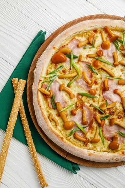 Italian pizza on a white wooden table