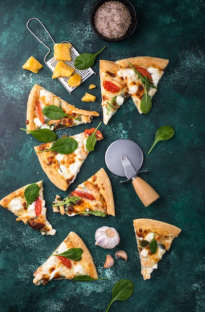 Italian pizza with feta cheese tomato and basil