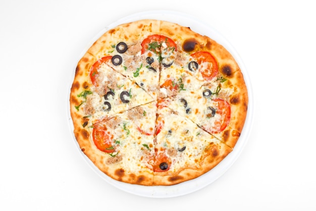 Italian pizza with melted mozzarella cheese olives and tomato