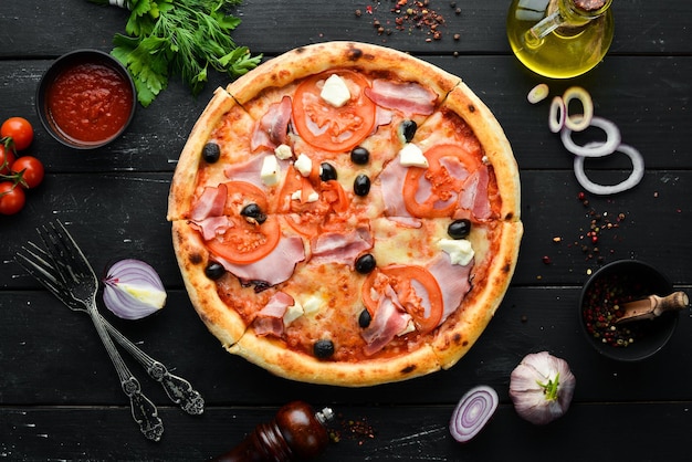 Italian pizza with tomatoes bacon and olives Top view Free space for your text