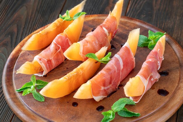 Italian prosciutto ham wrapped cantaloupe melon wedges