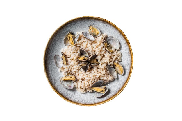 Italian Risotto with clams in a rustic plate with herbs Isolated on white background