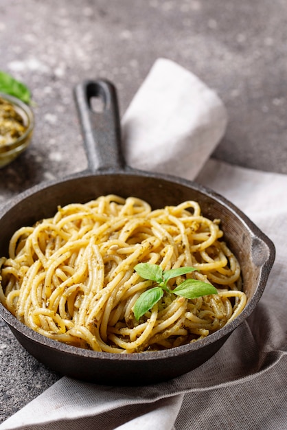 Italian spaghetti pasta with pesto sauce