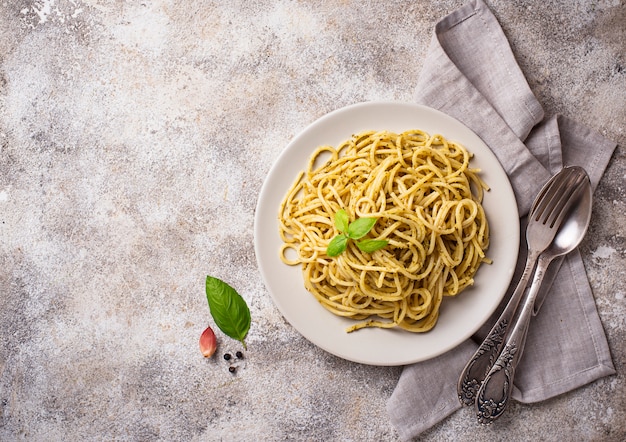 Italian spaghetti pasta with pesto sauce