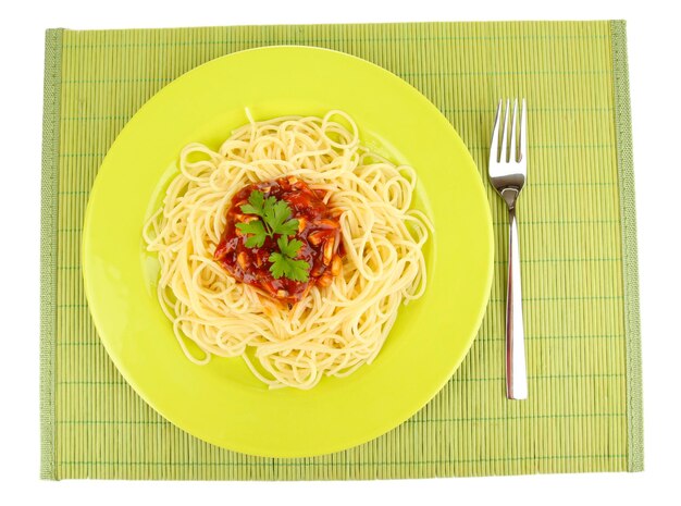 Italian spaghetti in plate on bamboo mat