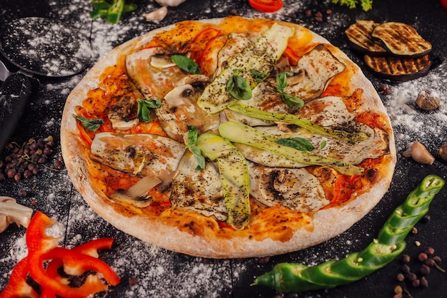 Italian vegetarian pizza with zucchini eggplant mushrooms and tomato