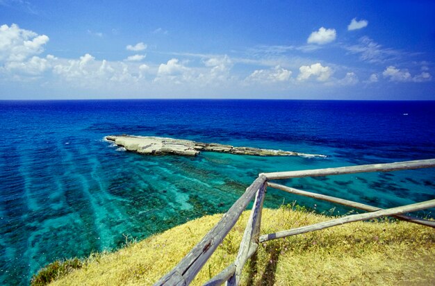 Italy, Mediterranean Sea, Calabria, Briatico; view of St. Irene rock, in which Romans carved vasks for moray eels aquaculture (FILM SCAN)