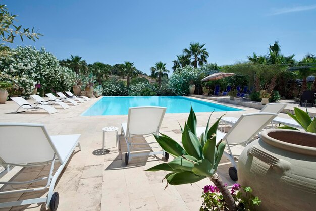 Italy, Sicily, Ragusa Province, countryside; 28 May 2018, private farm house, view of the garden and the swimming pool - EDITORIAL