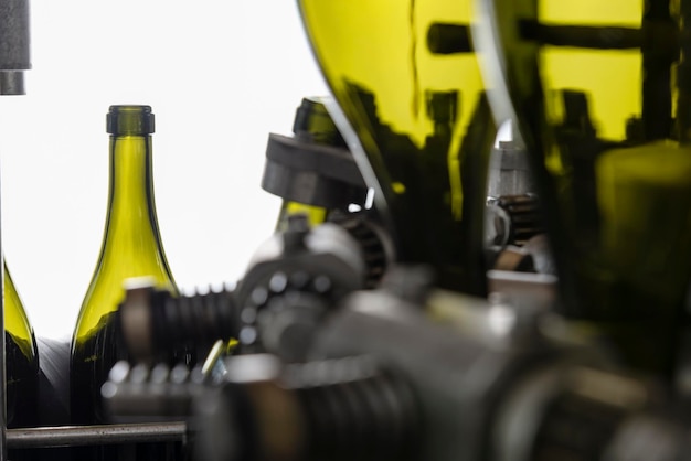 Italy Sicily wine bottles being washed and filled with wine by an industrial machine in a wine factory