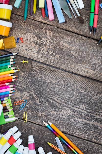 Items for children's creativity on a wooden background