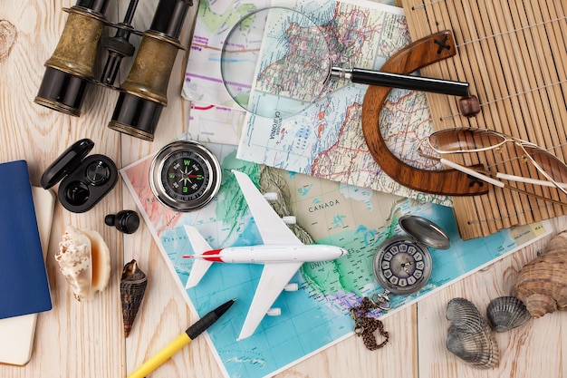 Items used in travel on the background of maps