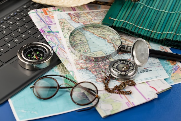 Items used in travel on the background of maps