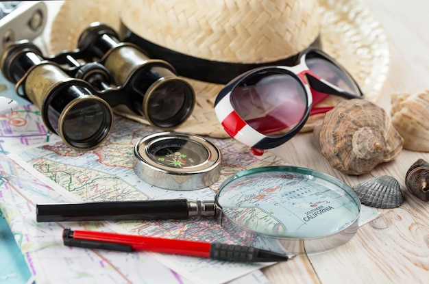 Items used in travel on the background of maps