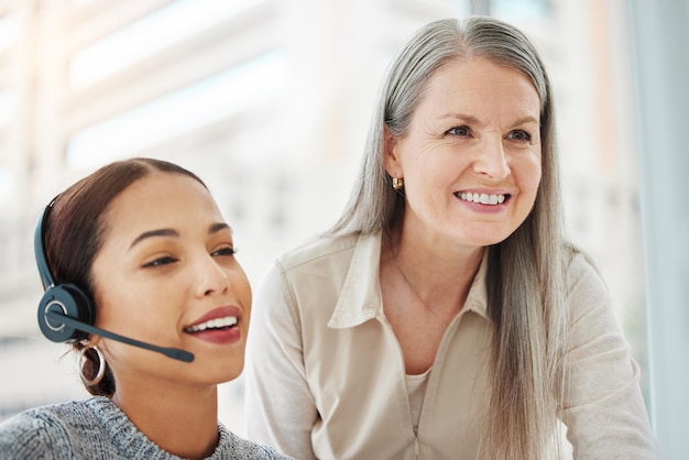 Its been a pleasure being of service Shot of an attractive young call centre agent sitting in the office and getting help from her manager