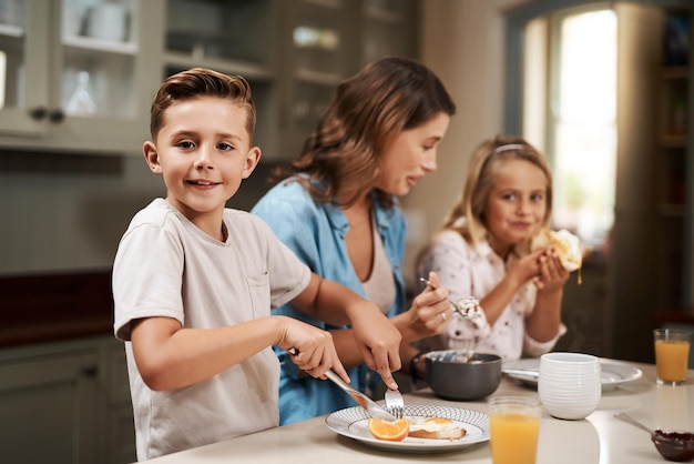 Its breakfast time Cropped shot of a young family having breakfast at home