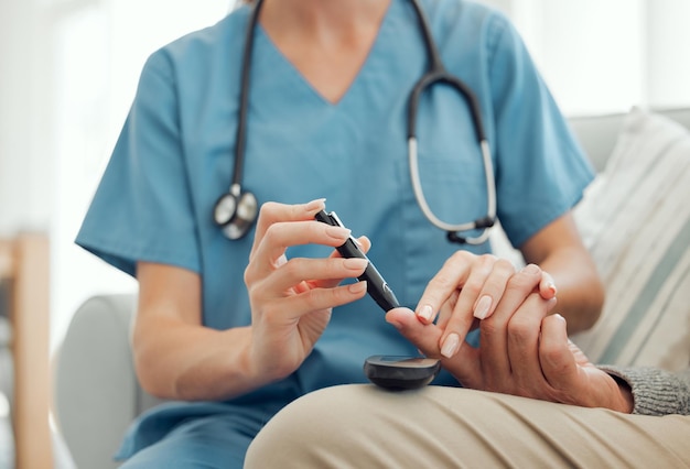 Its the quickest prick Shot of an unrecognizable doctor checking her patients glucose level at home