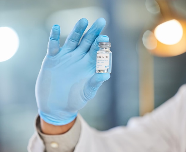 Its time for your booster shot Cropped shot of a medical practitioner holding a vaccine tube