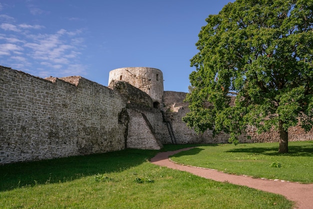 Izborsk Fortress wall and the Temnushka Tower on a sunny summer day Izborsk Pskov region Russia