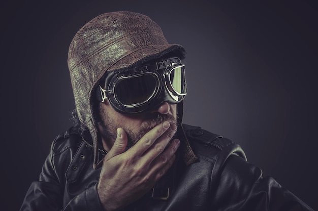 jacket, pilot dressed in vintage style leather cap and goggles