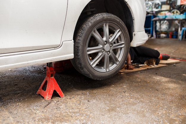 Jacking up a car for change the wheel.