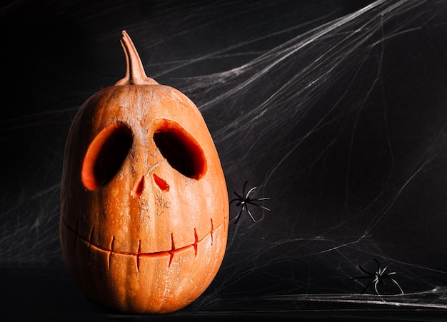 Jackolanterns and cobwebs in the dark Halloween celebration