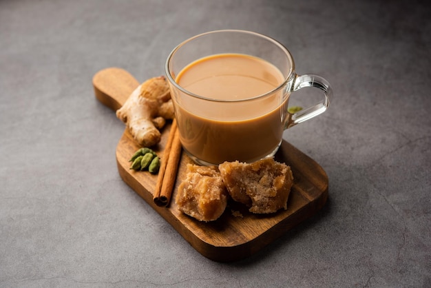 Jaggery tea or Gur ki chai with ingredients like gud ginger or adrak green cardamom and cinnamon