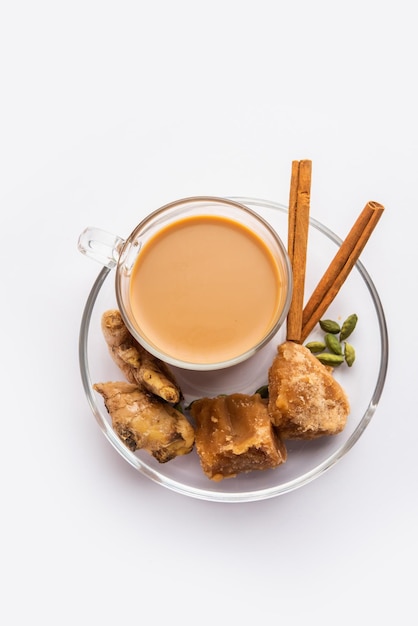 Jaggery tea or Gur ki chai with ingredients like gud ginger or adrak green cardamom and cinnamon