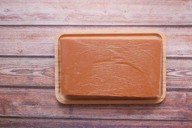 Jaggery traditional cane sugar cube on table