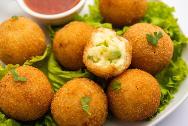 Jalapeno cheese balls or poppers served with tomato ketchup