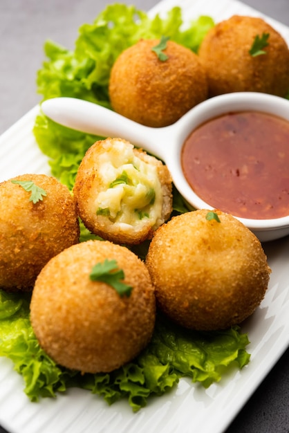 Jalapeno cheese balls or poppers served with tomato ketchup