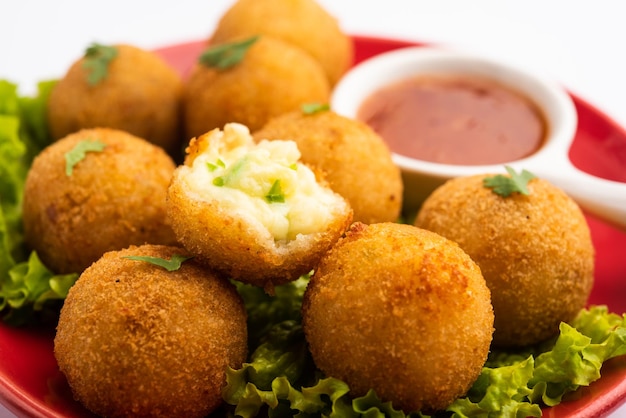 Jalapeno cheese balls or poppers served with tomato ketchup