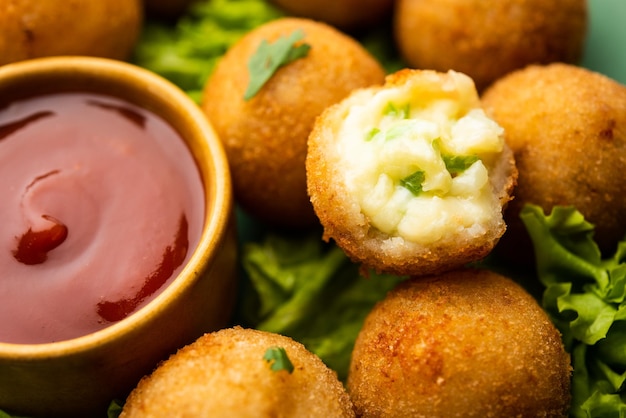 Jalapeno cheese balls or poppers served with tomato ketchup