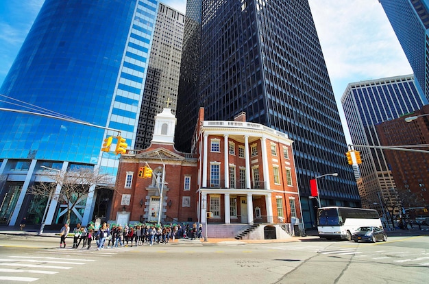 James Watson House of Financial District of Manhattan, New York City. Tourists are crossing the street.