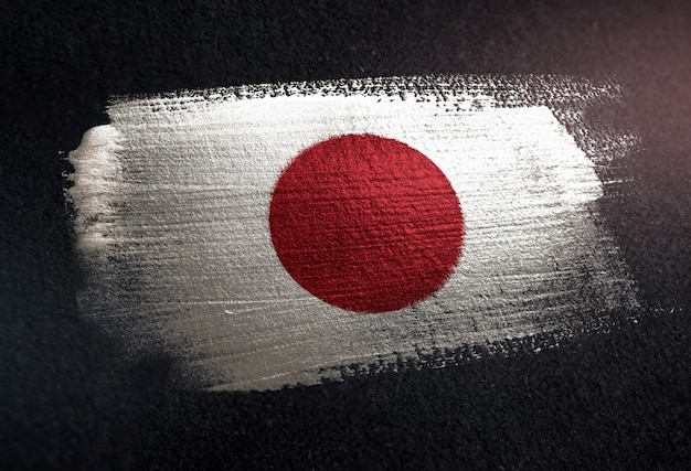 Japan Flag Made of Metallic Brush Paint on Grunge Dark Wall