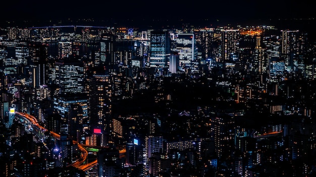 Japan modern urban skyline at night overlooking the beautiful Tokyo city Aerial view over cityscape Business finance and economy concept