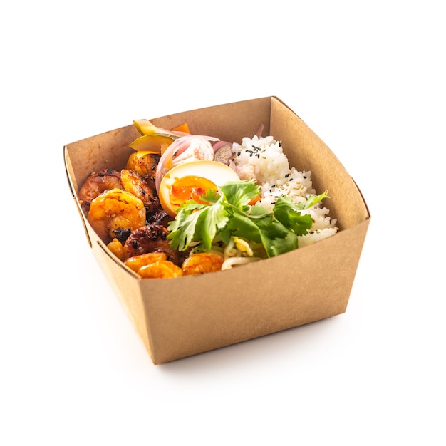 Japanese asian meal in a box of recycled paper isolated on white background. Concept of organic food packaging.