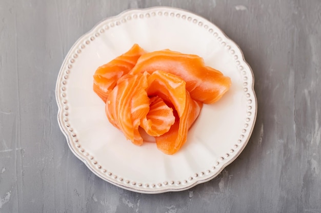 Japanese cuisine Salmon sushi on a white plate