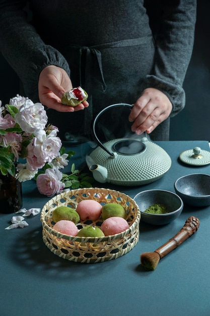 Japanese dessert mochi with matcha green tea powder and cherry japanese tea ceremony