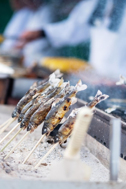 Japanese Fishes grilling Delicious traditional food in Arashiyama Kyoto Japan Asia travel and Street food concept