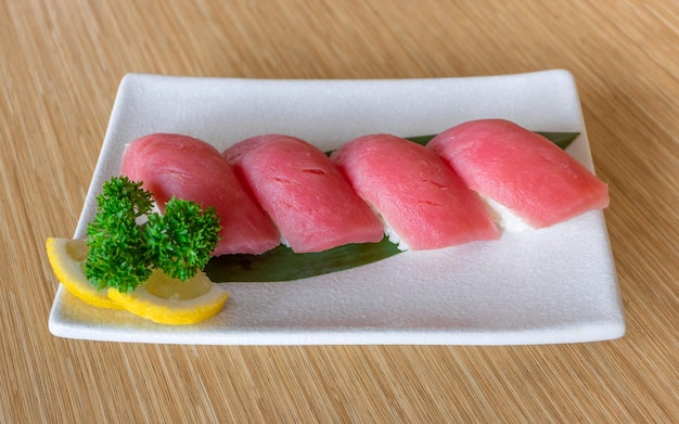 Japanese food fresh sashimi in white plate on wooden table