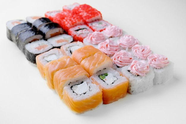 Japanese food restaurant delivery, sushi set . Sushi unagi, tempura rolls california with salmon, shrimp,  tuna, caviar and cheese isolated.