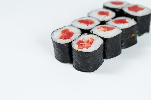 Japanese food. Rolls with red fish, fresh rice with eel, wrapped in nori.