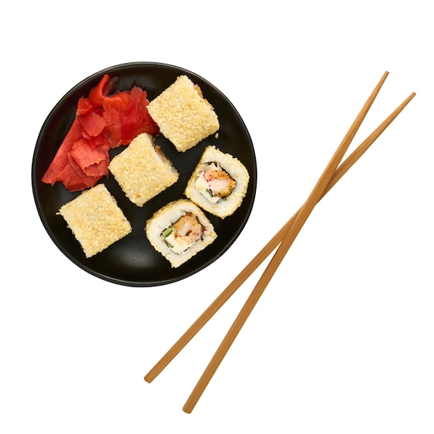 Japanese food sushi rolls ginger and chopsticks isolated on white background flat lay