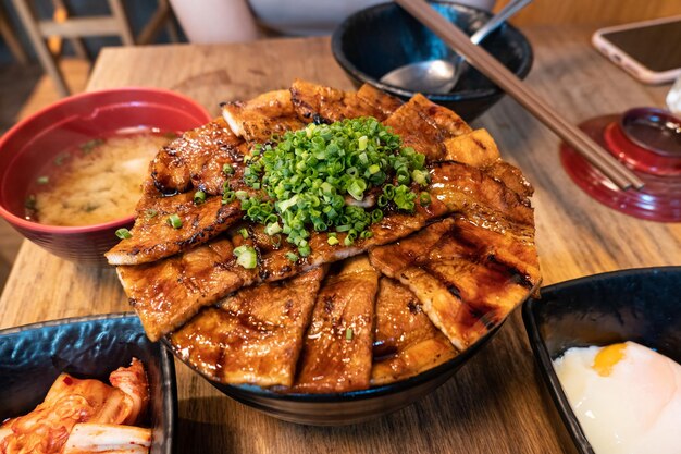 Japanese grilled pork soy sauce with rice Butadon Tokachi in bowl at japanese restaurant