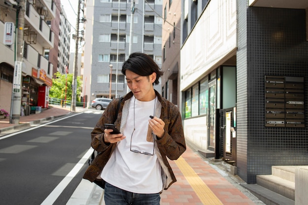 Japanese man walking outdoors