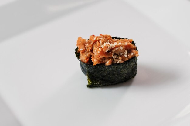 Japanese oriental cuisine Baked sushi rolls on white plate