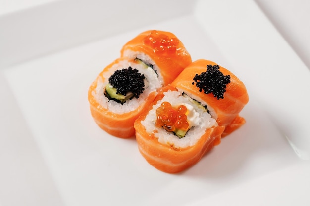 Japanese oriental cuisine Baked sushi rolls on white plate