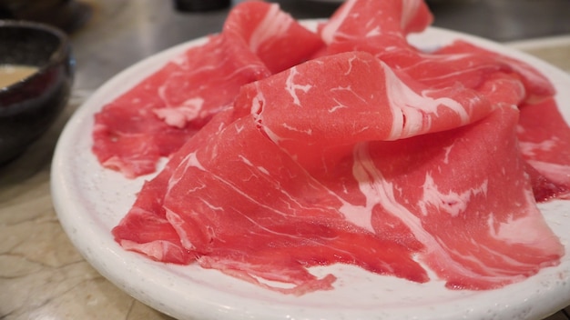 Japanese raw meat slide for shabu shabu in japan resturant.